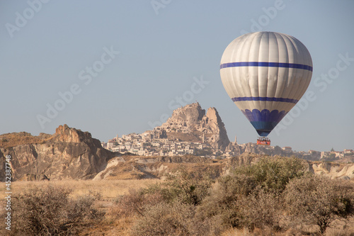 Cappadocia landscape, fairy chimneys and hot air balloon