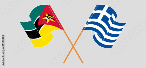 Crossed and waving flags of Mozambique and Greece