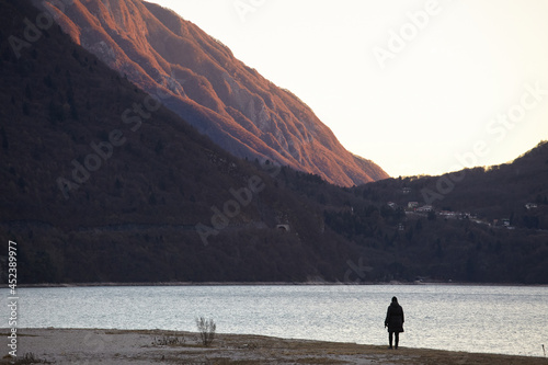 Silhouette of a person at Santa Croce lake photo