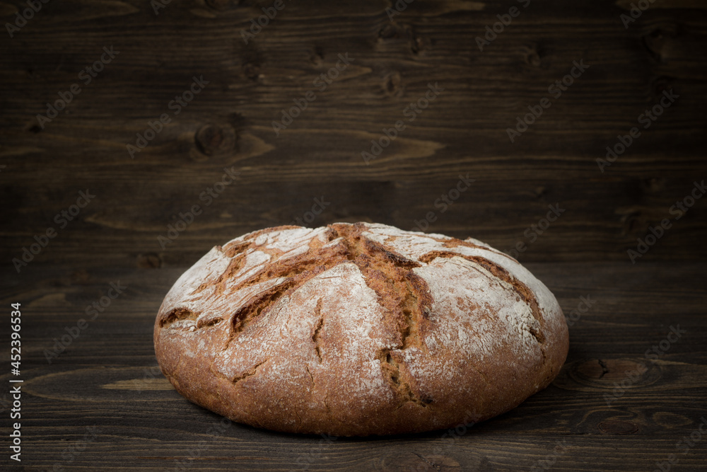 Rye bread on wooden background