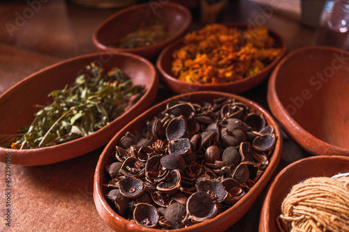 clay pots with spices to make natural pigment in fabric factory