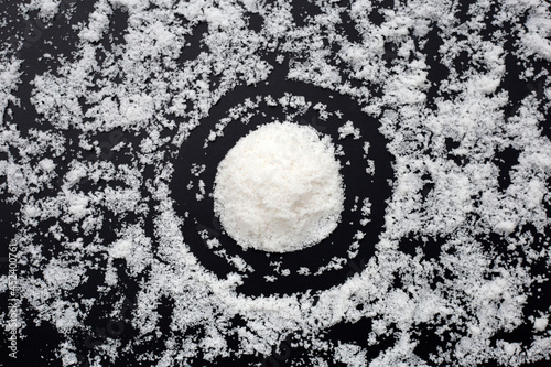 White salt on dark background.