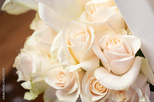 A view of an elegant collection of white roses in a box bouquet.