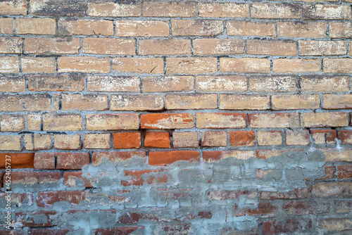 Detail of a faded brick wall