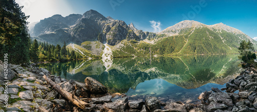 Fototapeta Naklejka Na Ścianę i Meble -  Tatra National Park, Poland. Panorama Famous Mountains Lake Morskie Oko Or Sea Eye Lake In Summer Morning. Five Lakes Valley. Beautiful Scenic View. European Nature