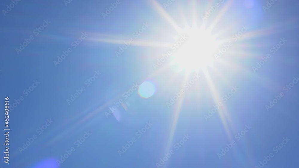 Direct ray of the sun in the blue sky
