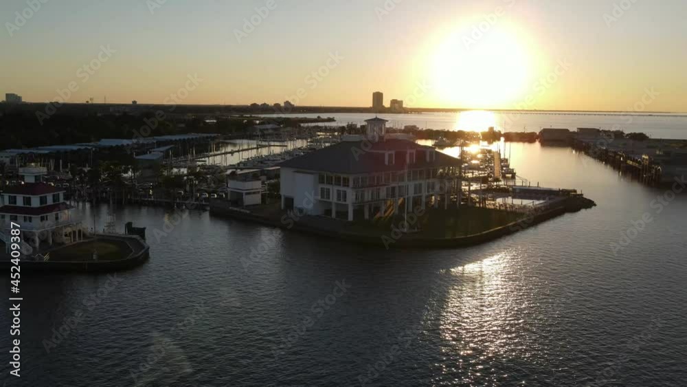 Southern Yacht Club, New Canal Lighthouse, And West End Point At Sunset In Lake Pontchartrain, New Orleans, Louisiana. - aerial Southern Yacht Club, New Canal Lighthouse, And West End Point At Sunset In Lake Pontchartrain, New Orleans, Louisiana. - aerial