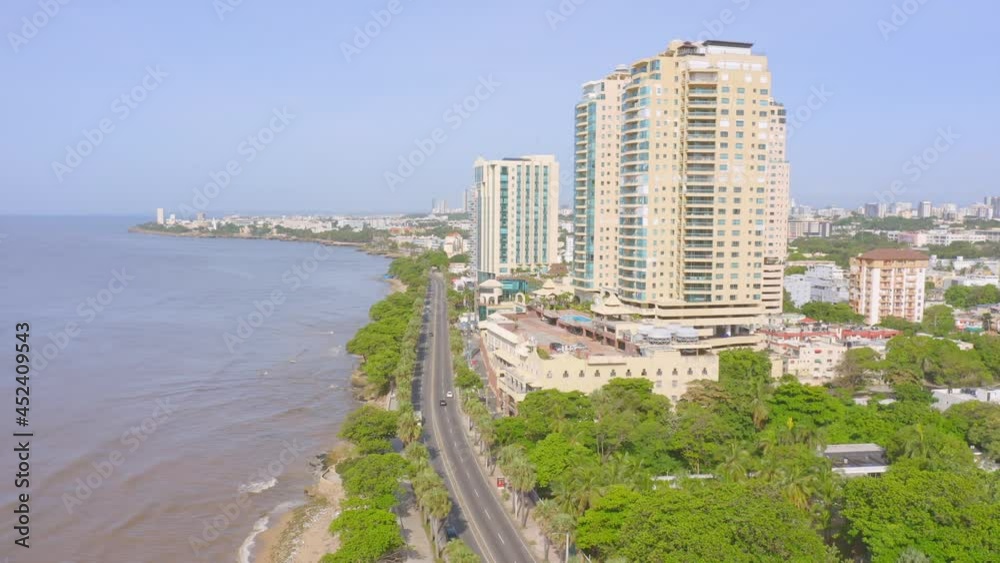 Ascend aerial shot showing coastline of Santo Domingo with George Washington Avenue and Malecon Center Buildings in Santo Domingo Ascend aerial shot showing coastline of Santo Domingo with George Washington Avenue and Malecon Center Buildings in Santo Domingo