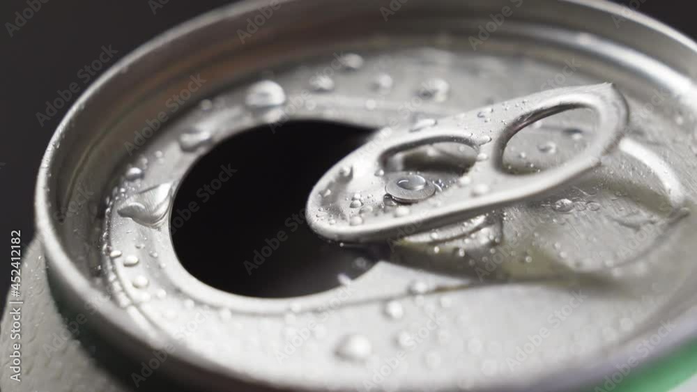 fingers open a tin can of drink. close-up. fingers open a tin can of drink. close-up.