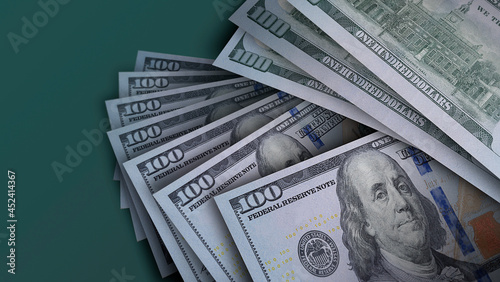 
$1,000 USD in $100 notes spread against casino green background