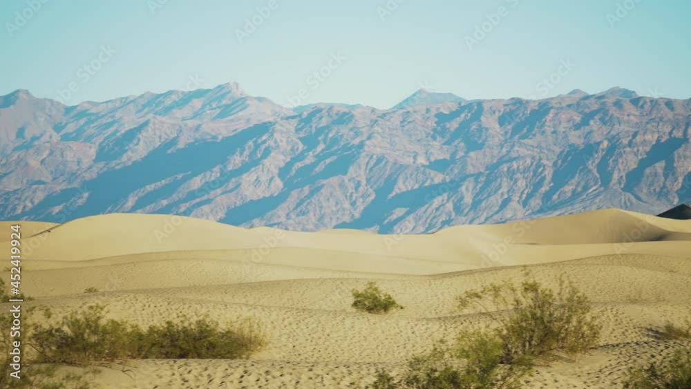 Pan Right View Across Mesquite Flat Sand Dunes On Hot Sunny Day Pan Right View Across Mesquite Flat Sand Dunes On Hot Sunny Day