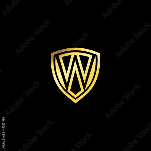 W letter emblem logo. Luxury gold shield design. Letter shield logo design concept template