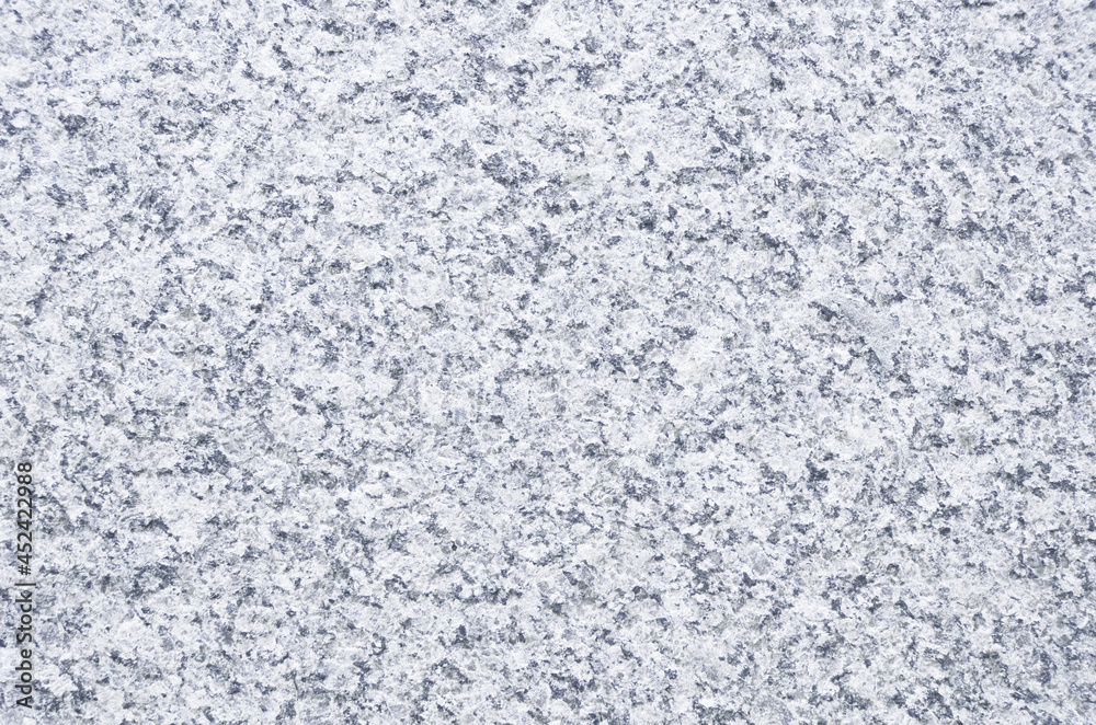 Light blue granite texture background. Close-up of granite surface.
