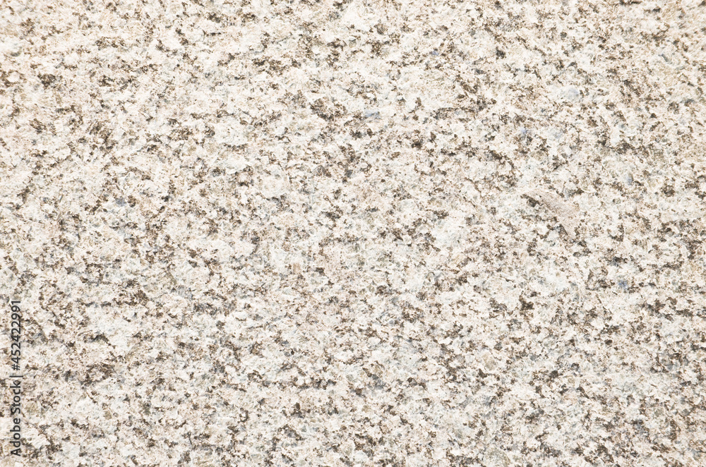 Beige granite texture background. Close-up of granite surface. Beige granite texture background. Close-up of granite surface.