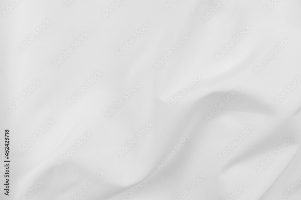 Abstract white fabric texture background. Cloth soft wave. Creases of satin, silk, and cotton. Abstract white fabric texture background. Cloth soft wave. Creases of satin, silk, and cotton.
