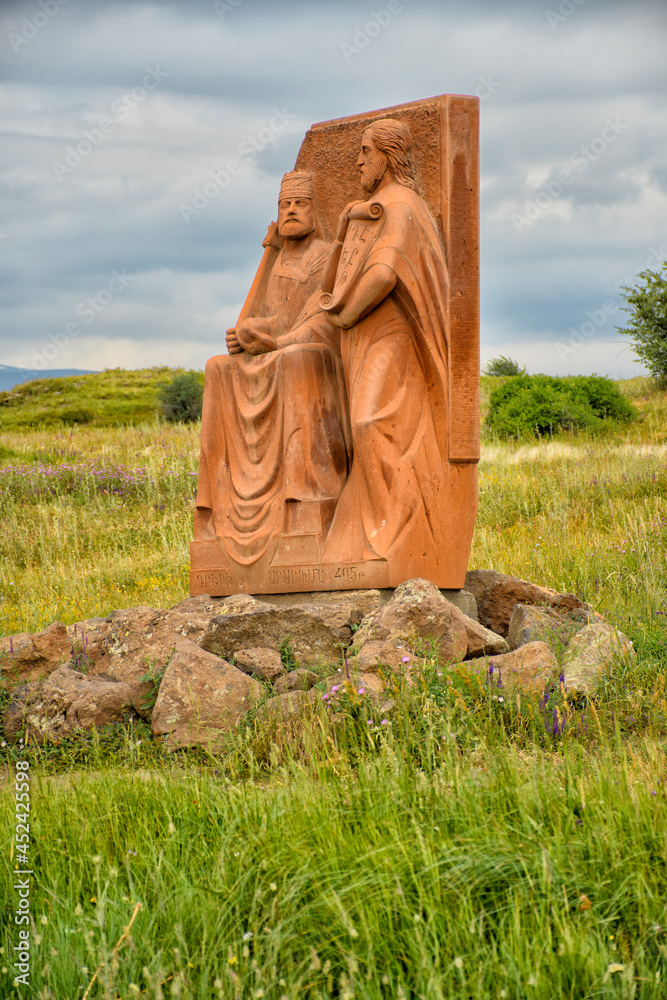 Fototapeta premium Statue in a field, sky on background