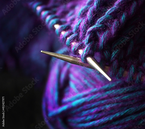 Knitting needles and wool yarn. Macro.