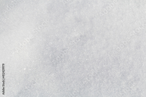 Winter snow. Snow texture Top view of the snow. Texture for design. Snowy white texture. Snowflakes.