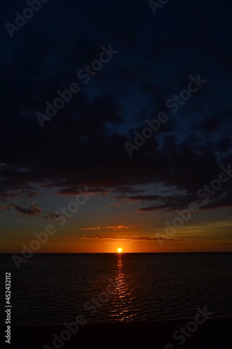 sunset over the ocean © Domingue