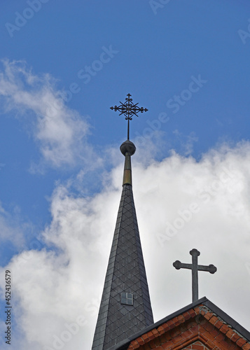 Fototapeta Naklejka Na Ścianę i Meble -  General view and architectural details of the Catholic Church of the Exaltation of the Holy Cross built in 1861 in the neo-Gothic style in the city of Olecko in Masuria, Poland.