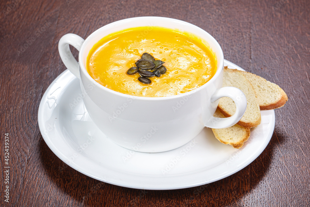 Tasty pumpkin soup with seeds Tasty pumpkin soup with seeds