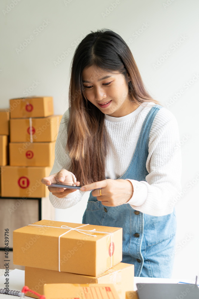 SME business online and delivery concept, freelance woman working at home with Online Parcel delivery. SME business online and delivery concept, freelance woman working at home with Online Parcel delivery.