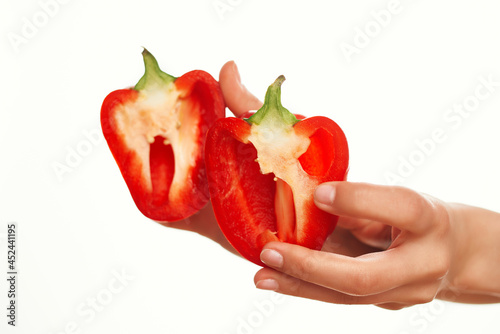 cut red pepper in the hands of vegetables vitamins