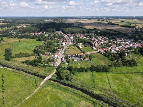 Polish countryside, farm, fields, meadows seen from above - photo drone 