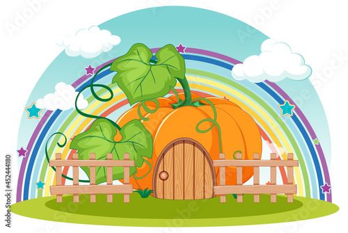 Pumpkin house with rainbow in the sky