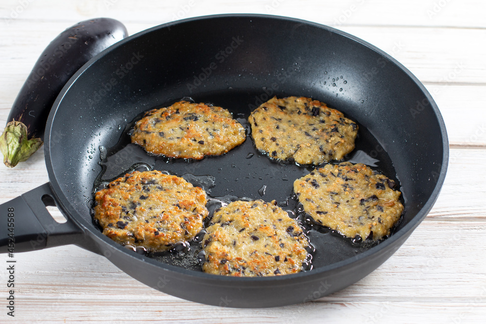 Eggplant pancakes, pan fried snack pancakes from minced eggplant. Eggplant pancakes, pan fried snack pancakes from minced eggplant.