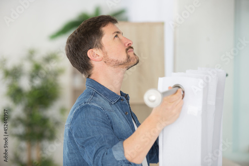 man holding curtains photo