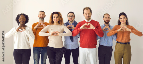 Фотография Studio group portrait of thankful youth and senior citizens sending you love, support and gratitude