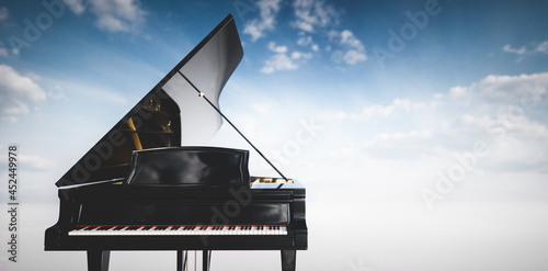 Grand piano on blue sky background photo