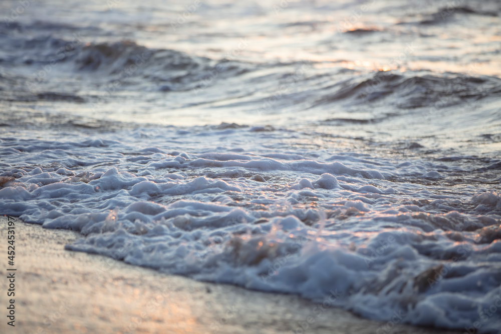 Beautiful wave with foam in the evening sea. Beautiful wave with foam in the evening sea.