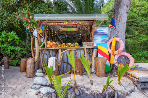 Fototapeta Naklejka Na Ścianę i Meble -  Exotic summer beach bar with mixed fruits coconut, banana and tropical fruits in Seychelles tropical island.