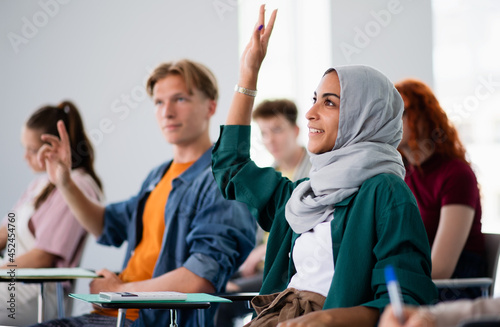 Photography Group of university students sitting in classroom indoors, studying