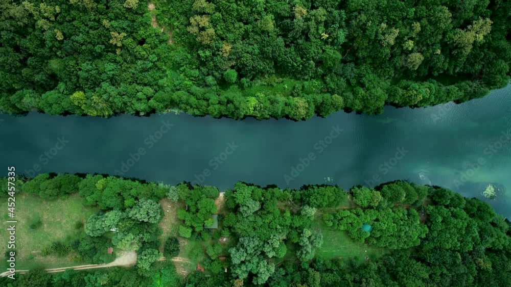 Aerial view of a person doing Kayak in Mreznica River near Generalski Stol, Karlovac, Croatia. Aerial view of a person doing Kayak in Mreznica River near Generalski Stol, Karlovac, Croatia.