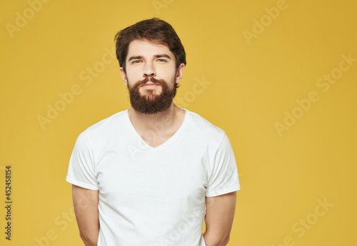 emotional man in a white t-shirt serious look Lifestyle