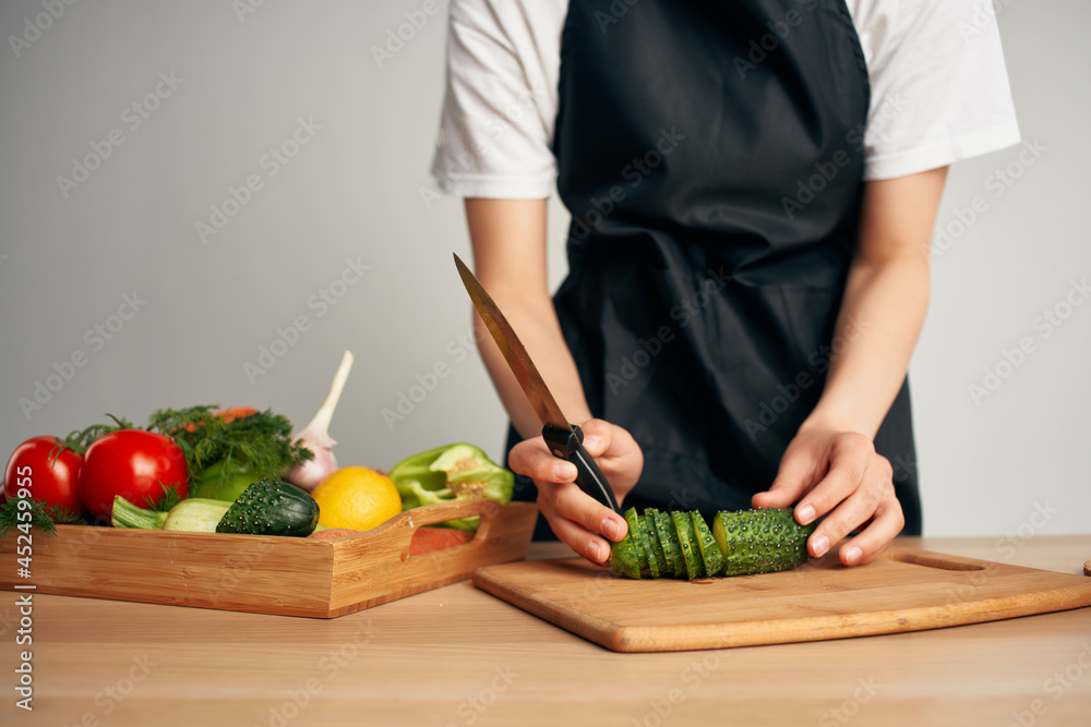 chef in the kitchen cutting vegetables vitamins housework