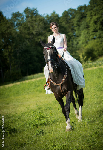 Beautiful portrait of woman bride with horse © Zelma