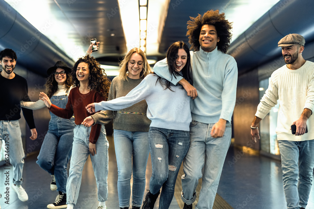 © Alessandro Biascioli - Happy young friends hanging out in subway underground metropolitan © Alessandro Biascioli - Happy young friends hanging out in subway underground metropolitan
