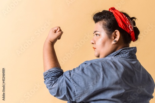 latinx woman showing her strength. hispanic adult woman photo