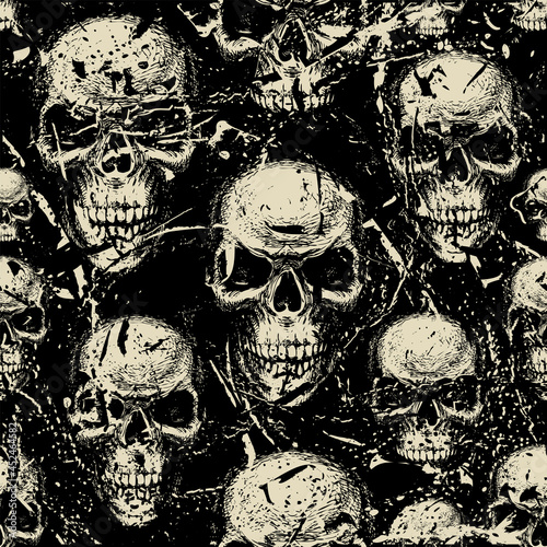 Seamless pattern with hand-drawn human skulls in the grunge style. Vector background with sinister skulls looking out of the dark. Graphic print for clothing, fabric, wallpaper, wrapping paper