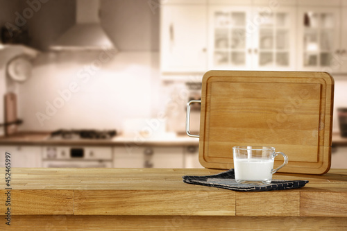 Fresh milk on desk and kitchen interior 