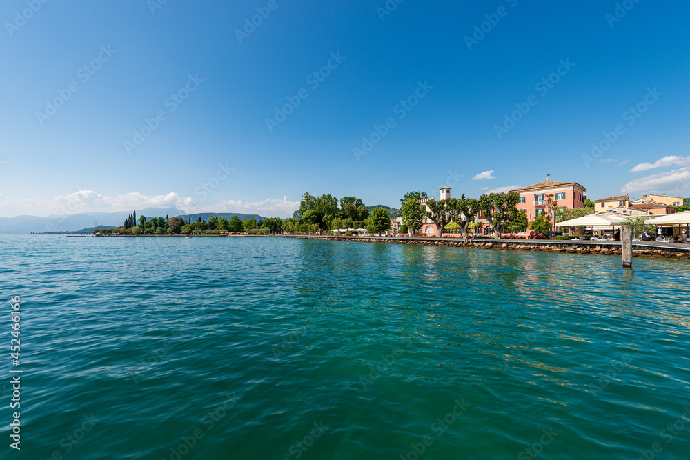 Lakefront of the small Bardolino village, tourist resort on the coast of the lake Garda (Lago di Garda), Verona province, Veneto, Italy, southern Europe.