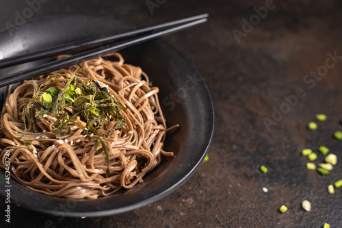 buckwheat noodles soba fresh portion ready to eat meal snack on the table copy space food background rustic. top view keto or paleo diet veggie vegan or vegetarian food