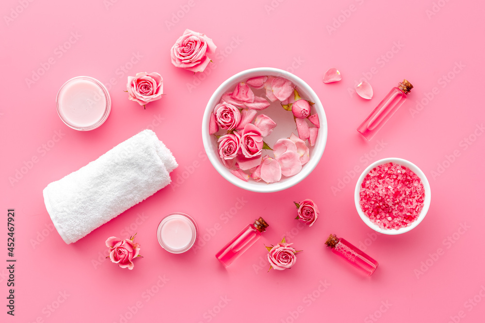 Roses petals in water with sea salt and aroma oil. Spa cosmetics Roses petals in water with sea salt and aroma oil. Spa cosmetics