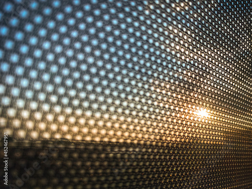 Abstract colorful discs on sunlight gradient background. Background of art bubbles in halftone style with colored gradient