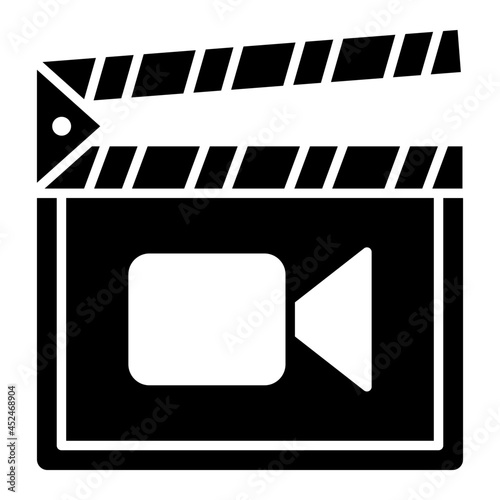 A solid design icon of clapperboard photo