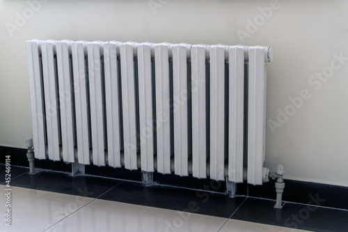 White heating radiator on wall background